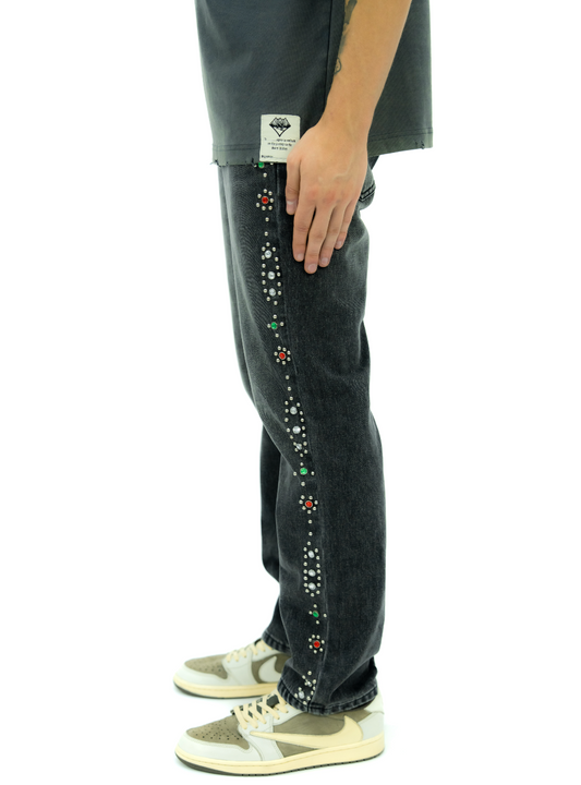 Black jeans with colorful embellishments 